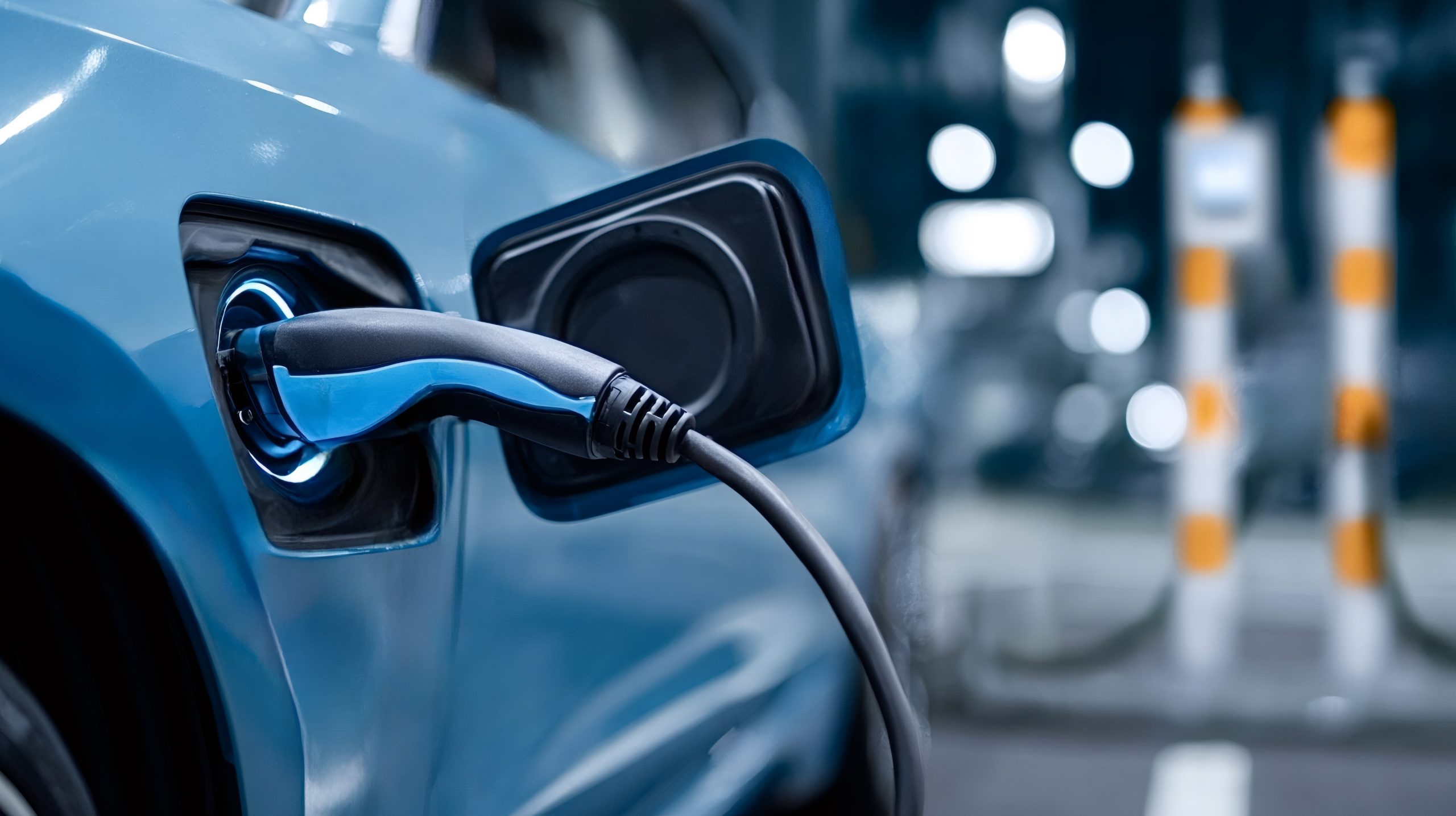 Electric car charging with power cable connector at station