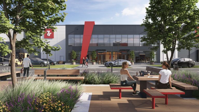 Außenansicht des Logistik- und Technologiezentrums 7R Hub Nowa Huta in Krakau mit Menschen und moderner Umgebung.