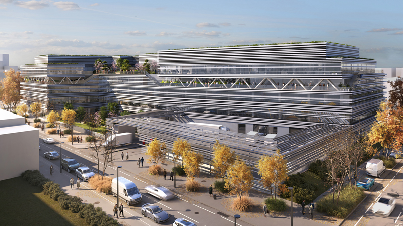 Außenansicht des neuen Forschungs- und Entwicklungszentrums in der Seestadt Aspern, Wien, modern gestaltetes Gebäude mit Begrünung und Dach-PV-Anlage.