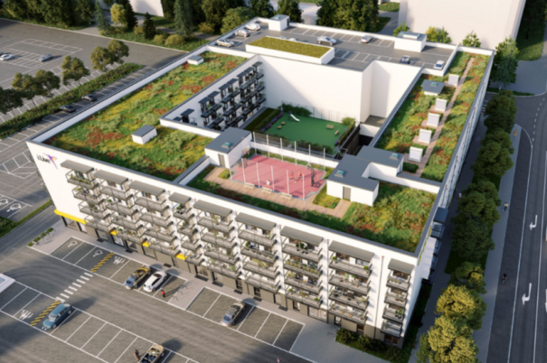Luftaufnahme des Gebäudes Urban Living Südtor Rostock mit begrüntem Dach und Innenhof.
